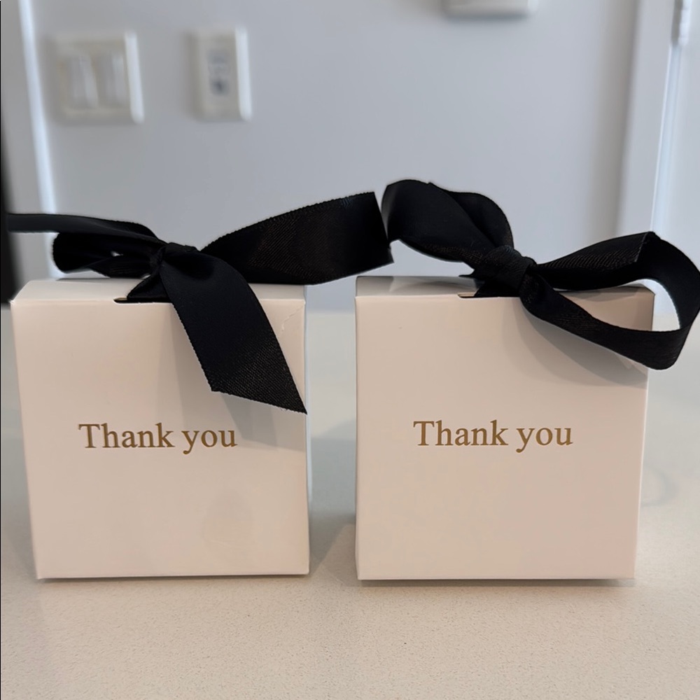 Elegant White Gift Boxes with Black Ribbon